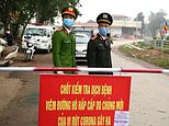Vietnamese police stand guard at a checkpoint set up at the Son Loi commune in Vinh Phuc province amid concerns about a COVID-19 coronavirus outbreak