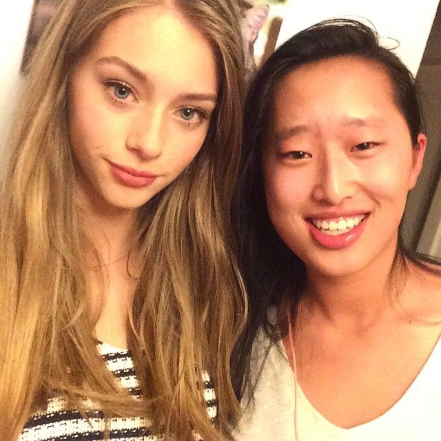 This may contain: two young women are posing for the camera