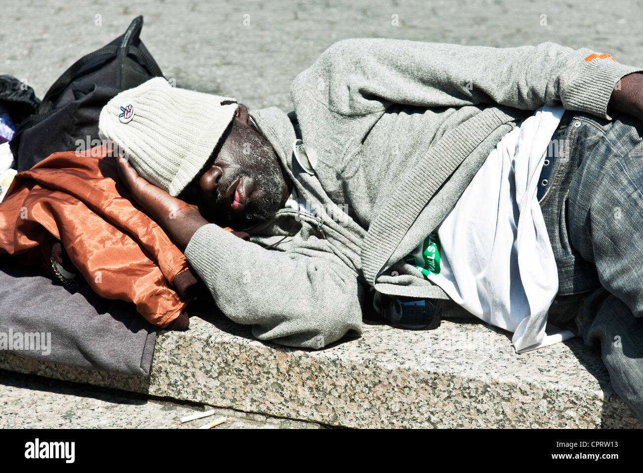 close-view-black-man-wearing-occupy-wall-street-tee-shirt-snoozing-CPRW13.jpg