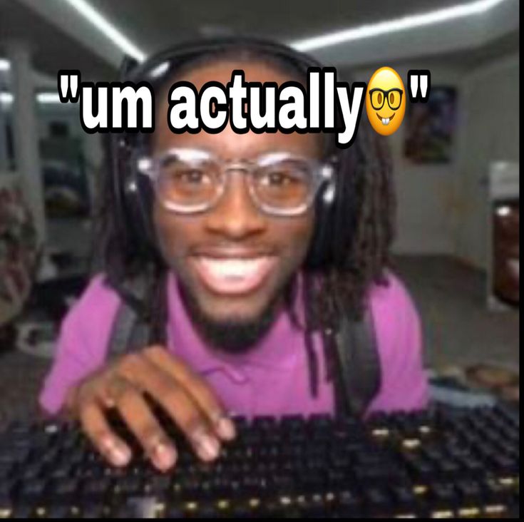 This may contain: a man wearing headphones and sitting in front of a keyboard with the caption, i'm actually