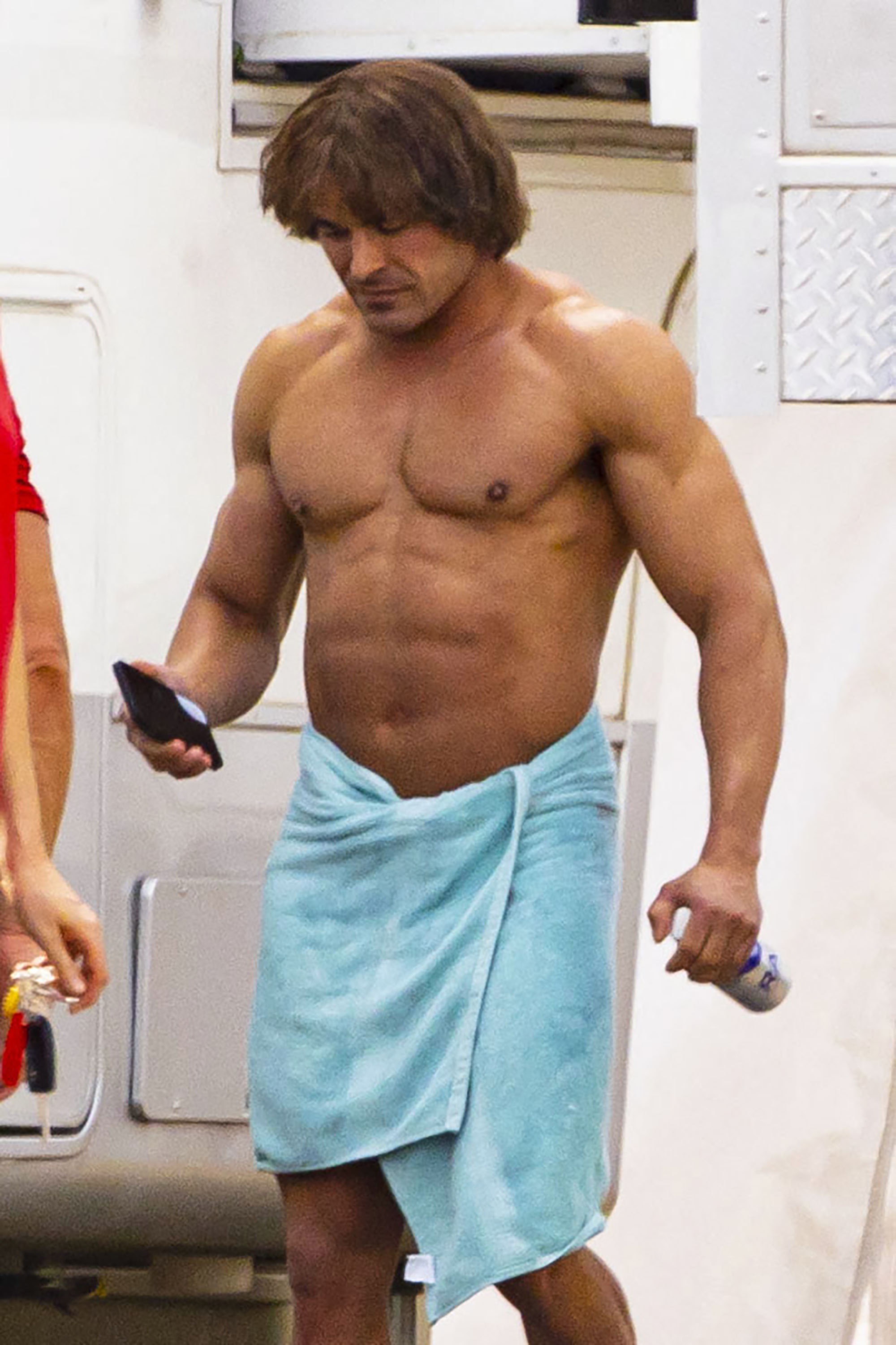 Zac Efron is unrecognizable with beefed up physique, bowl haircut