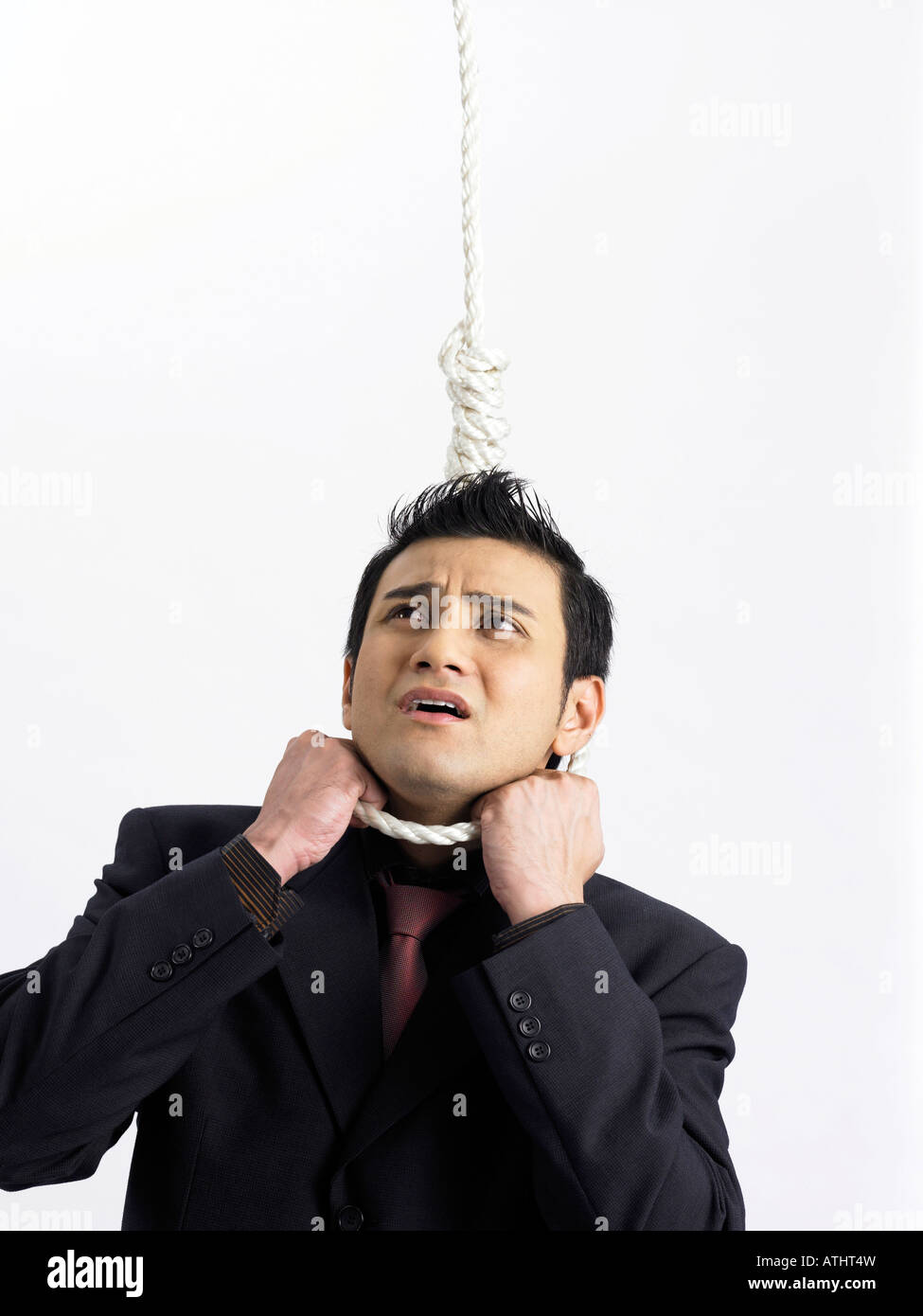 businessman-with-rope-hanging-around-his-neck-ATHT4W.jpg