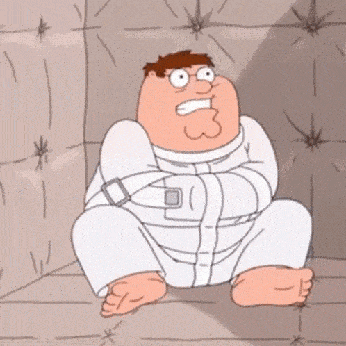 peter griffin is sitting in a straight jacket with the number 3 on his face