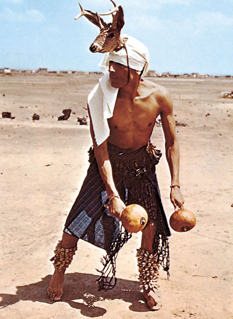 dancer-Yaqui-Deer-Sonora-rattles-deer-hoof-legs.jpg