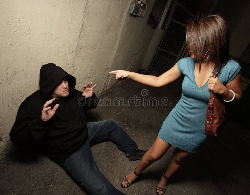 woman-standing-over-robber-8731726.jpg