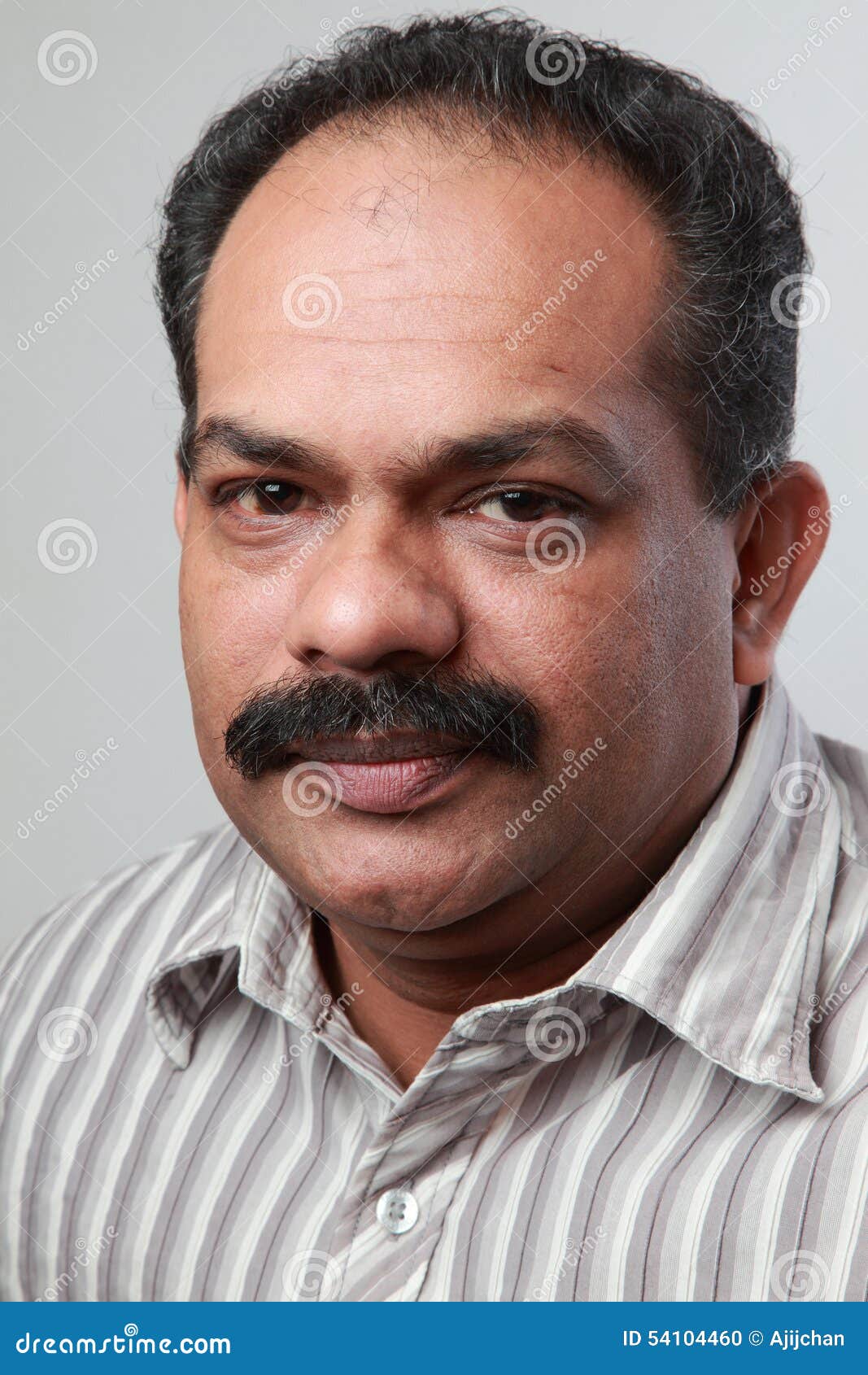 middle-aged-indian-male-portrait-54104460.jpg