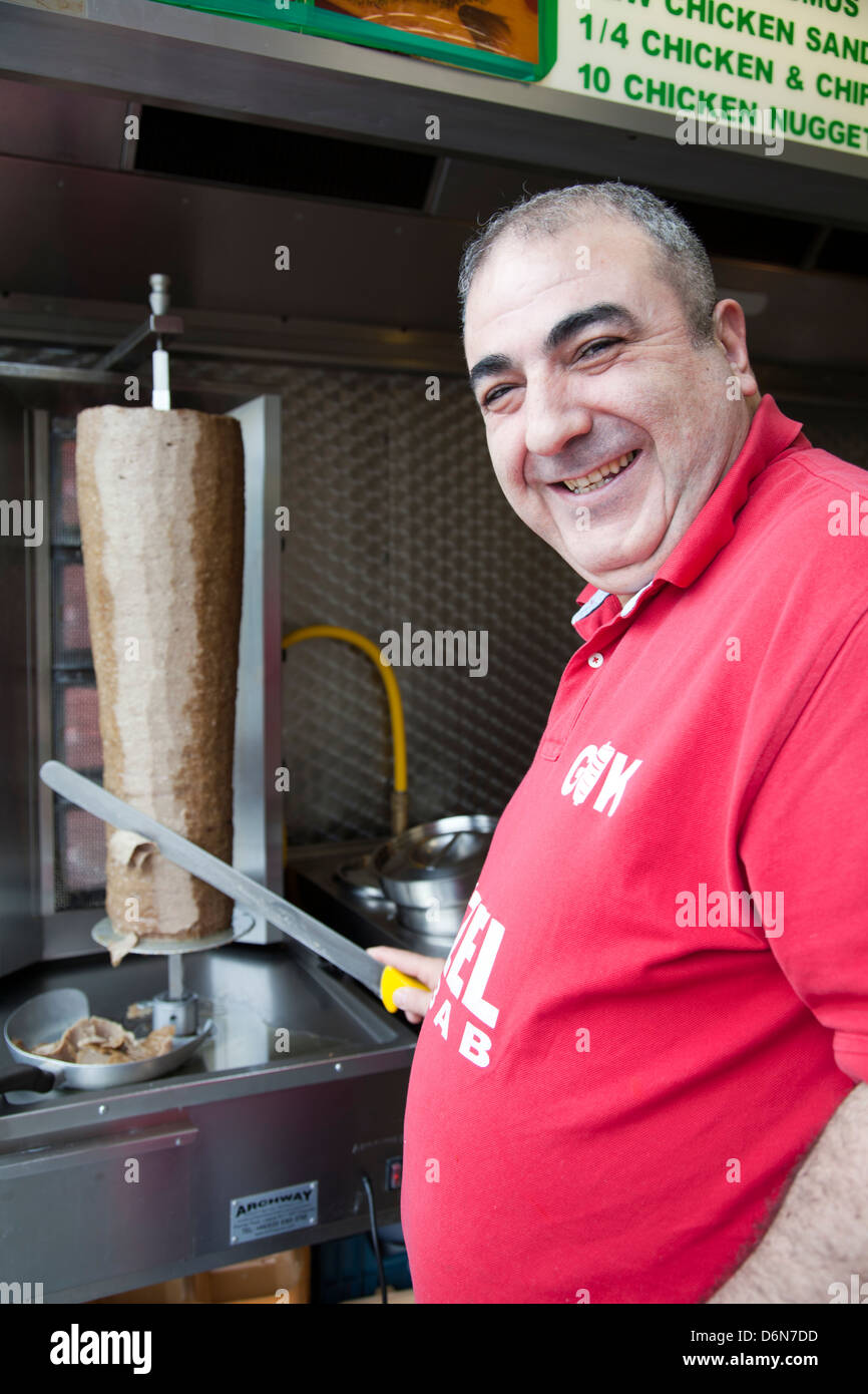 man-cutting-doner-in-kebab-shop-london-uk-D6N7DD.jpg