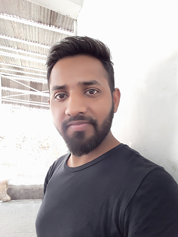 image-of-young-handsome-hindu-man-in-early-20s-taking-selfie-with-picture-id1213122388