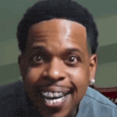a close up of a man 's face with braces on his teeth .