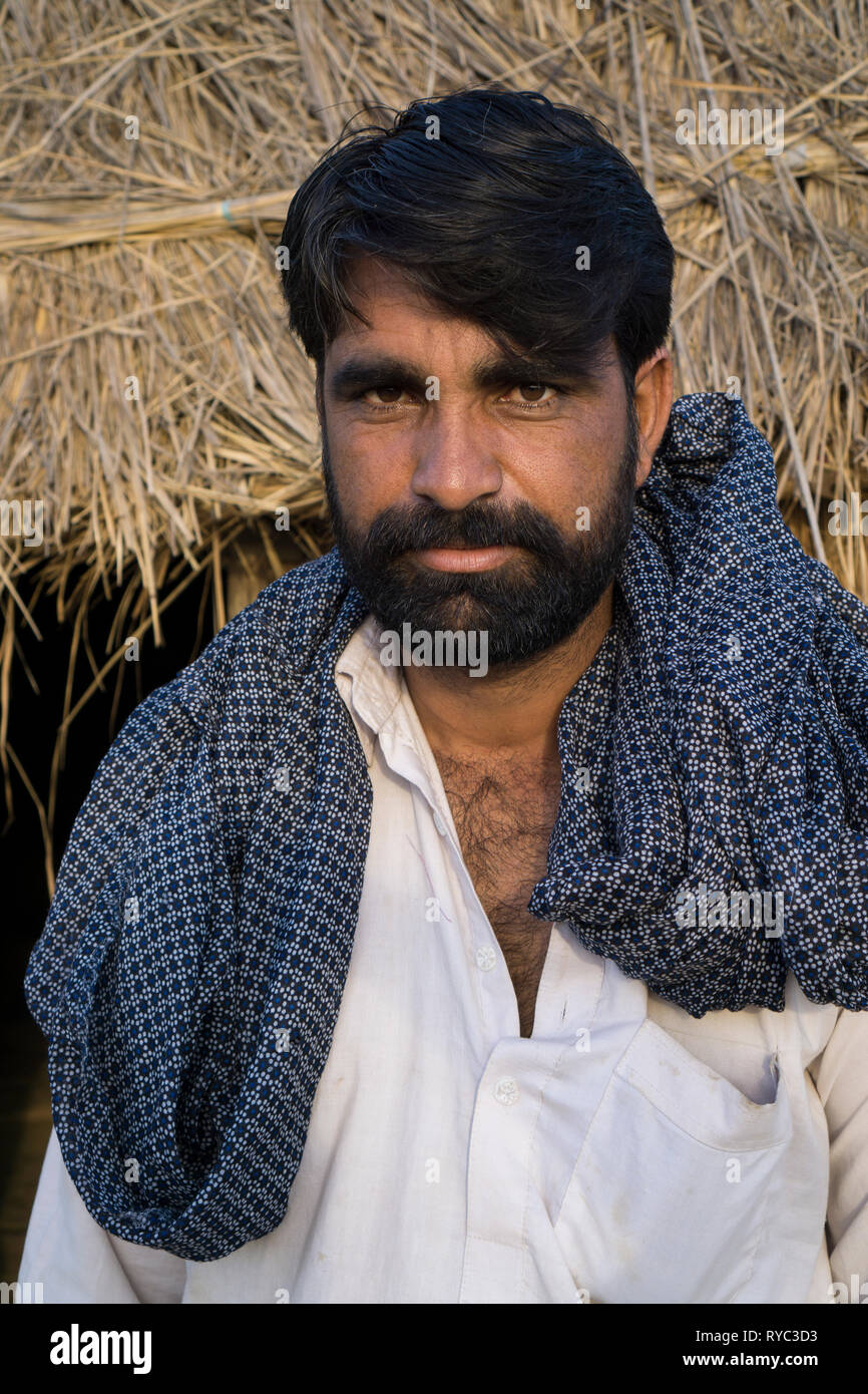 pakistani-man-standing-outdoors-looking-at-camera-RYC3D3.jpg