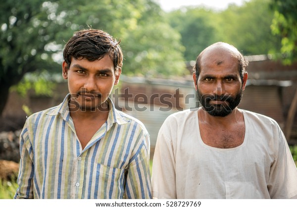 indian-rural-two-men-village-600w-528729769.jpg