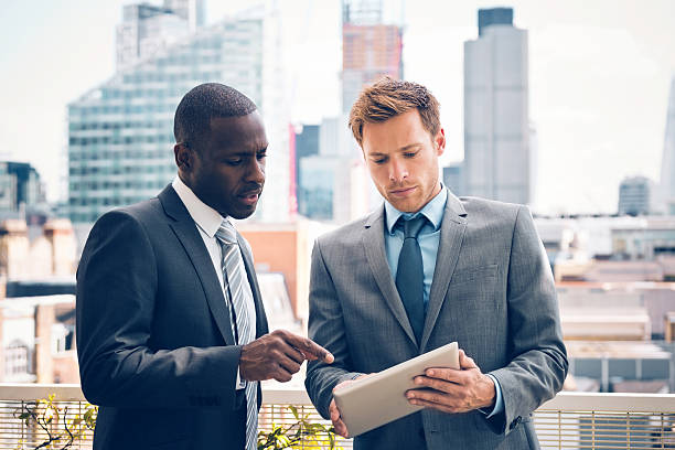 business-people-discussing-project-on-digital-tablet.jpg