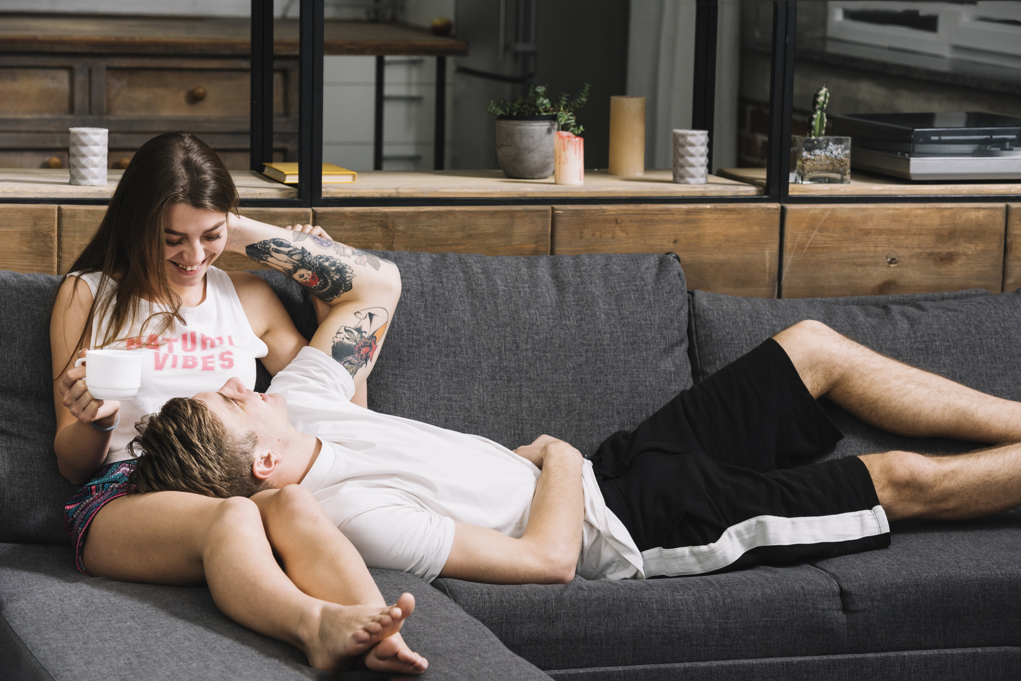 man-lying-woman-lap-couch_23-2148027330.jpg