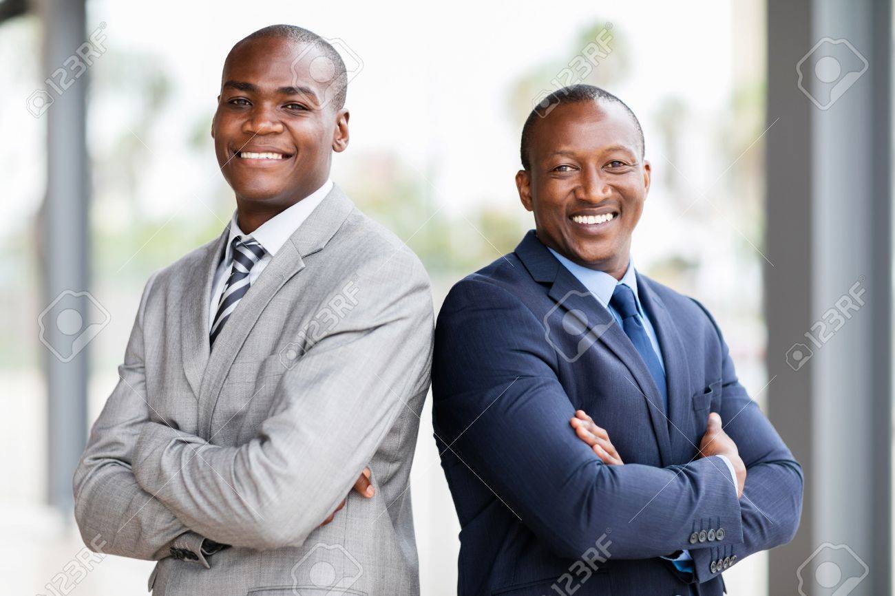 54871126-happy-african-businessmen-with-arms-crossed-in-office.jpg