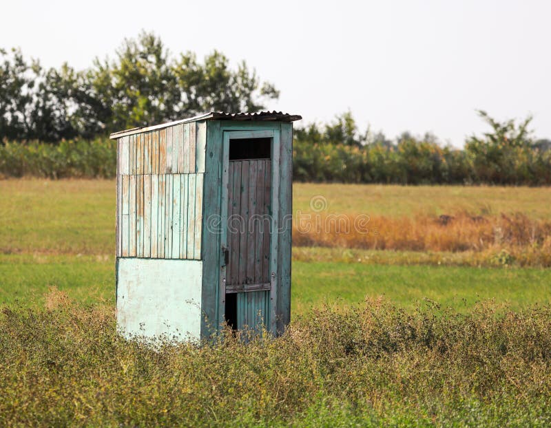 old-wooden-toilet-field-140860644.jpg