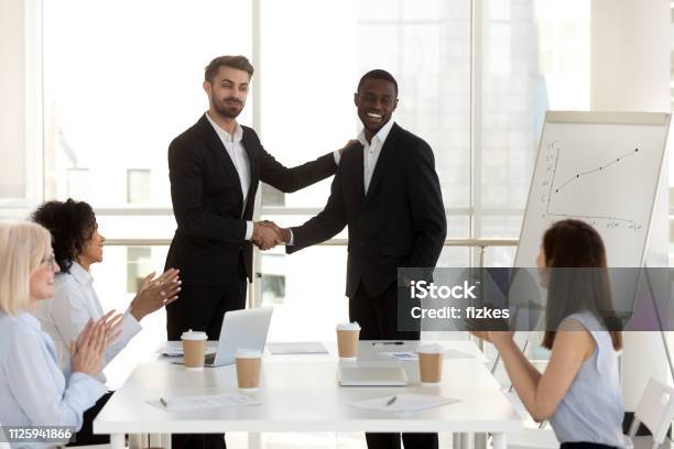 boss-introduce-new-black-employee-to-colleagues.jpg
