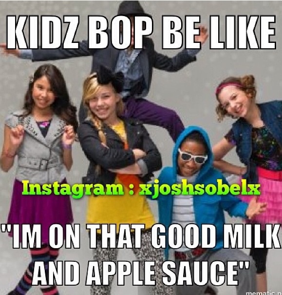 This may contain: the kids are posing in front of an advertisement for apple juice, and one is wearing a hoodie