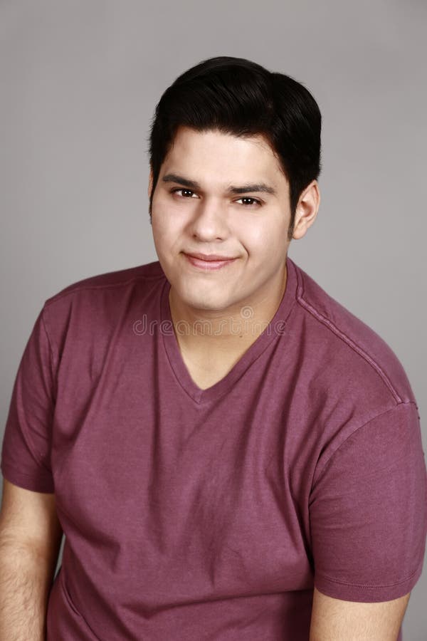 young-latino-man-smiling-headshot-hispanic-72316090.jpg