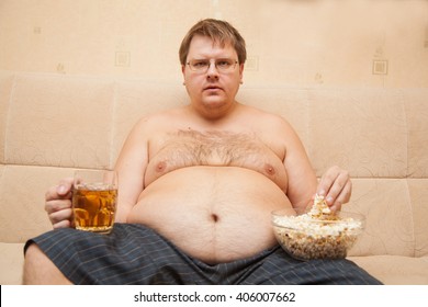 fat-man-eating-popcorn-drinking-260nw-406007662.jpg