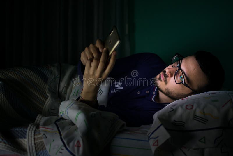 man-looking-his-mobile-phone-bed-night-man-looking-his-mobile-phone-bed-night-lifestyle-concept-technology-149665515.jpg