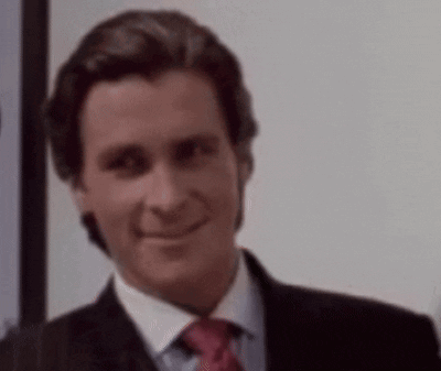 a man in a suit and tie is smiling at the camera .