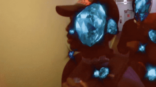a man wearing a hat with a diamond in his eyes