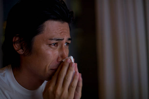 man-blowing-his-nose-with-tears.jpg