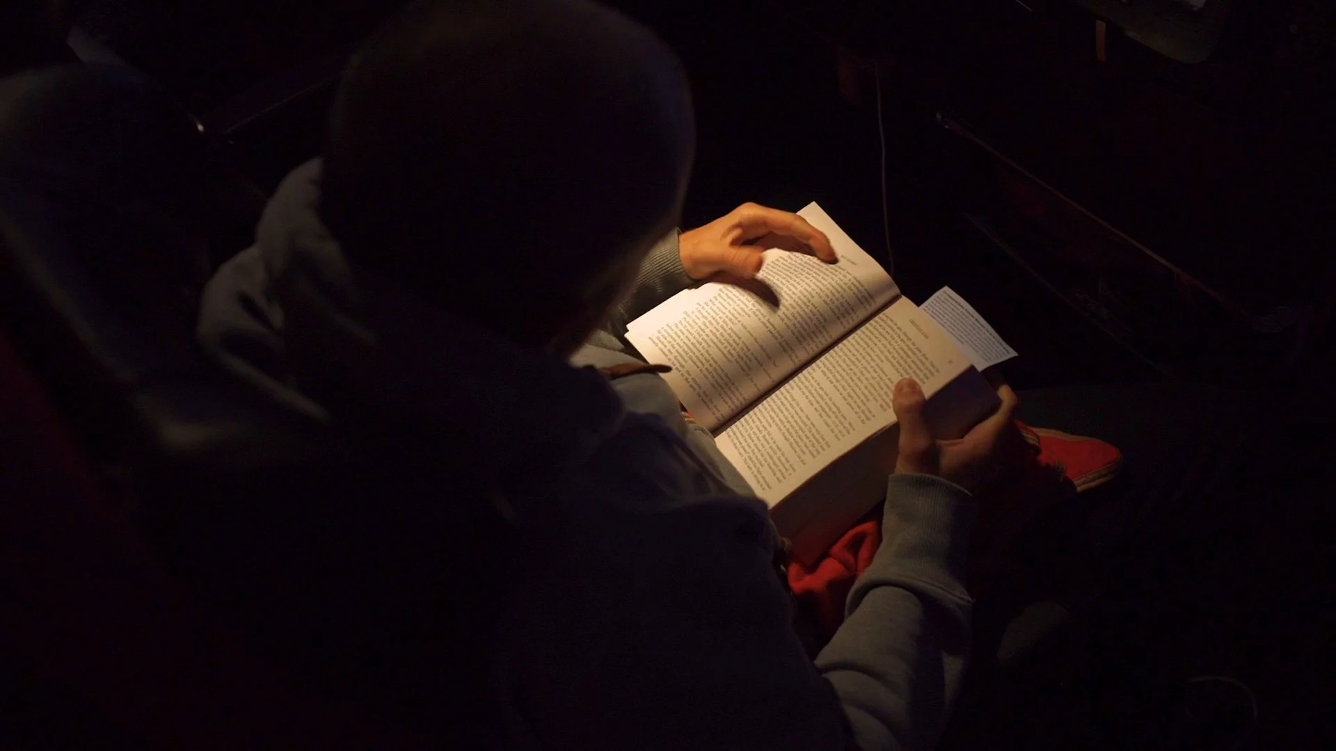 overhead-shot-man-reading-dark-084900724_prevstill.jpeg