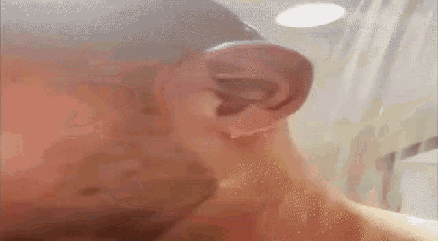 a close up of a man 's ear in a blurry photo