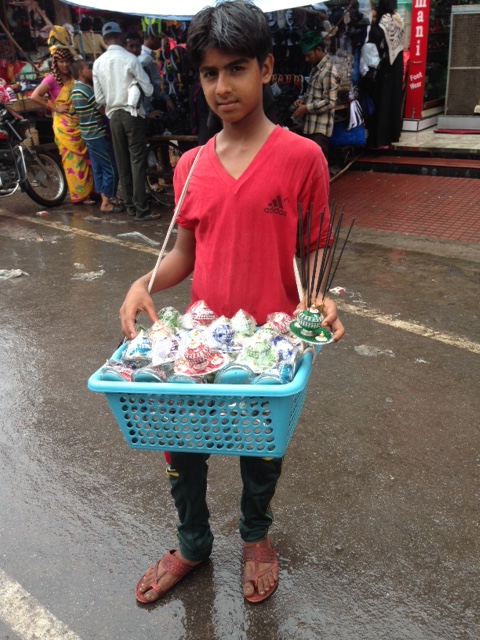 young-vendor-selling-prayer-materials.jpg