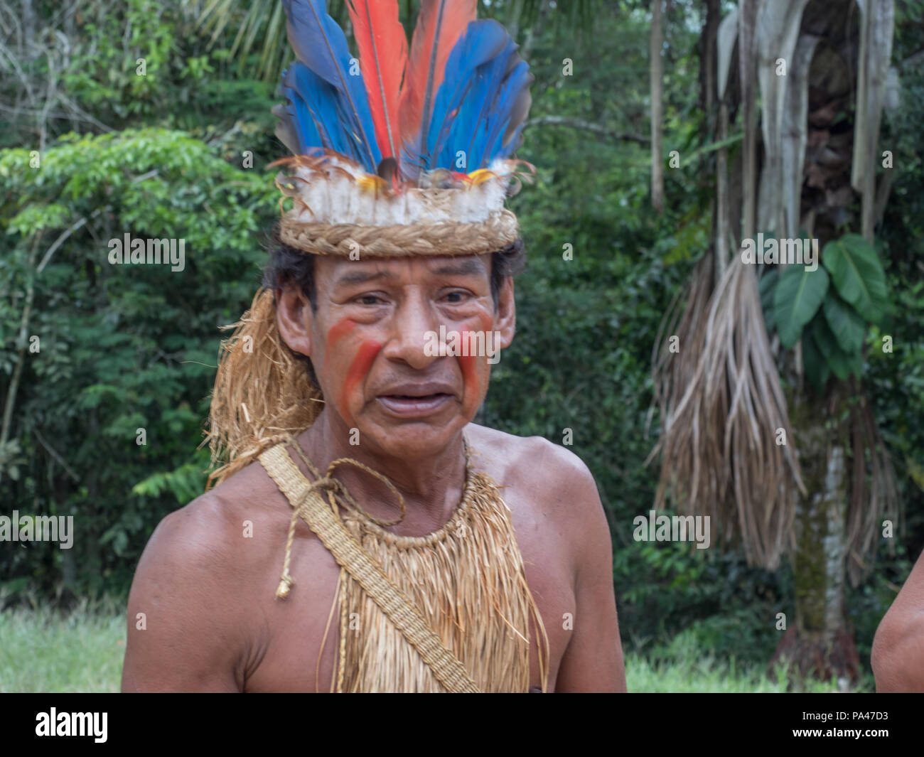 iquitos-peru-mar-28-2018-indian-from-yagua-tribe-in-his-local-costume-PA47D3.jpg