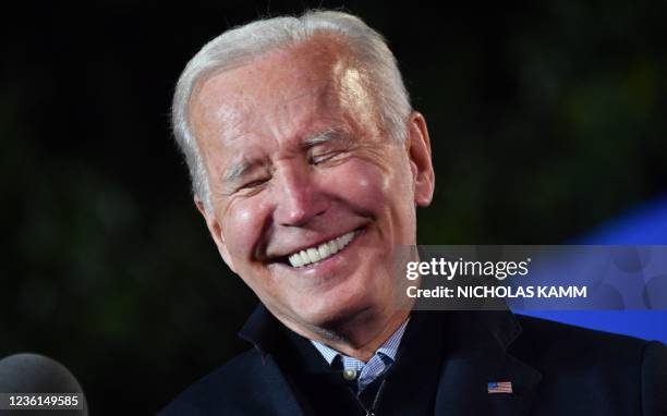us-president-joe-biden-smiles-as-he-speaks-during-a-campaign-event-for-virginia-democratic.jpg