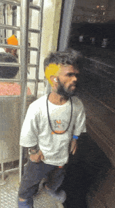 a man wearing a white shirt with a picture of a tiger on it