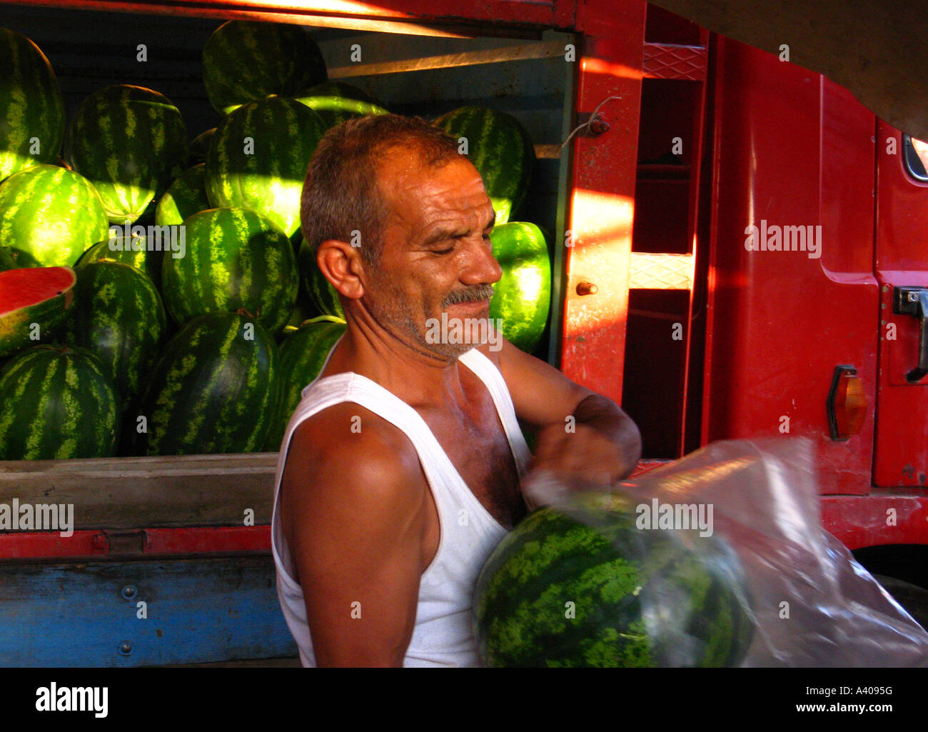 turk-sells-watermelons-at-street-bazaar-alanya-turkey-A4095G.jpg