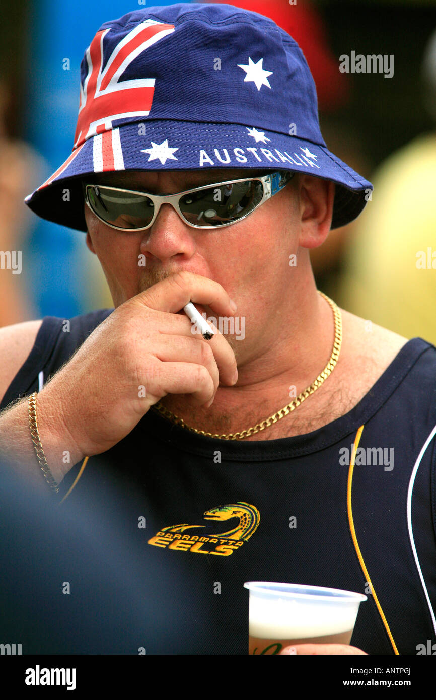 an-aussie-male-complete-with-nationalistic-flag-sun-hat-cigarette-ANTPGJ.jpg