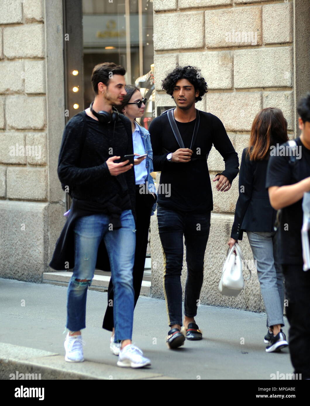 milan-akash-kumar-walking-downtown-with-friends-akash-kumar-26-year-old-indio-brazilian-model-who-participated-in-dancing-with-the-stars-walks-through-the-streets-of-downtown-with-friends-here-he-is-still-talking-in-via-montenapoleone-with-a-friend-on-the-bike-then-a-fan-asking-him-for-a-picture-and-finally-he-leaves-MPGABE.jpg