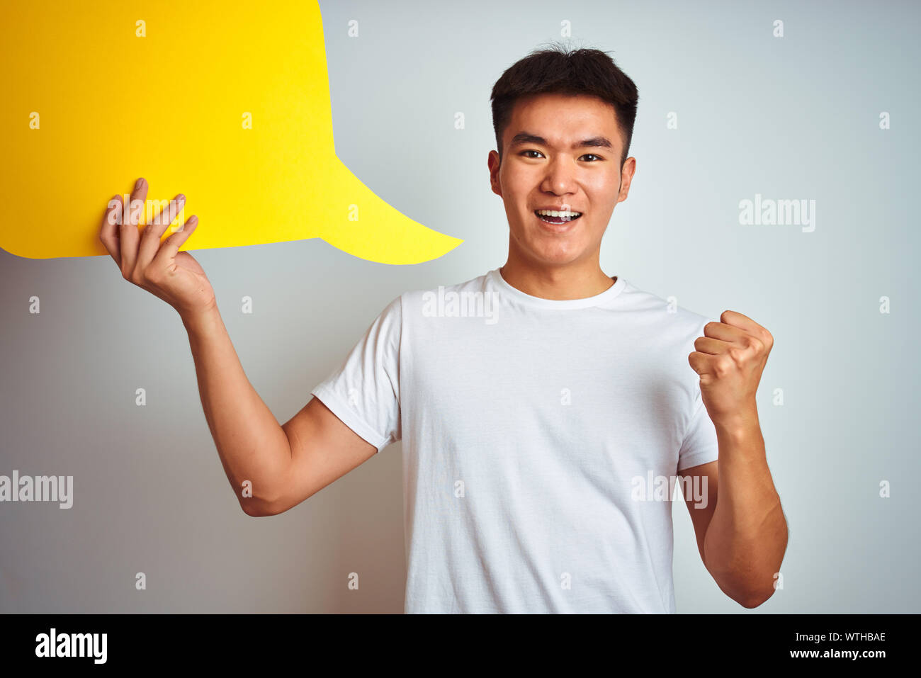 Asian chinese man holding speech bubble standing over isolated white  background screaming proud and celebrating victory and success very  excited, chee Stock Photo - Alamy Asian chinese man holding speech bubble standing over isolated white  background screaming proud and celebrating victory and success very  excited, chee Stock Photo - Alamy