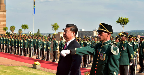 Chinese President Xi Jinping inspects the military guard of honour during his state visit to South Africa at the Union Buildings in Pretoria.