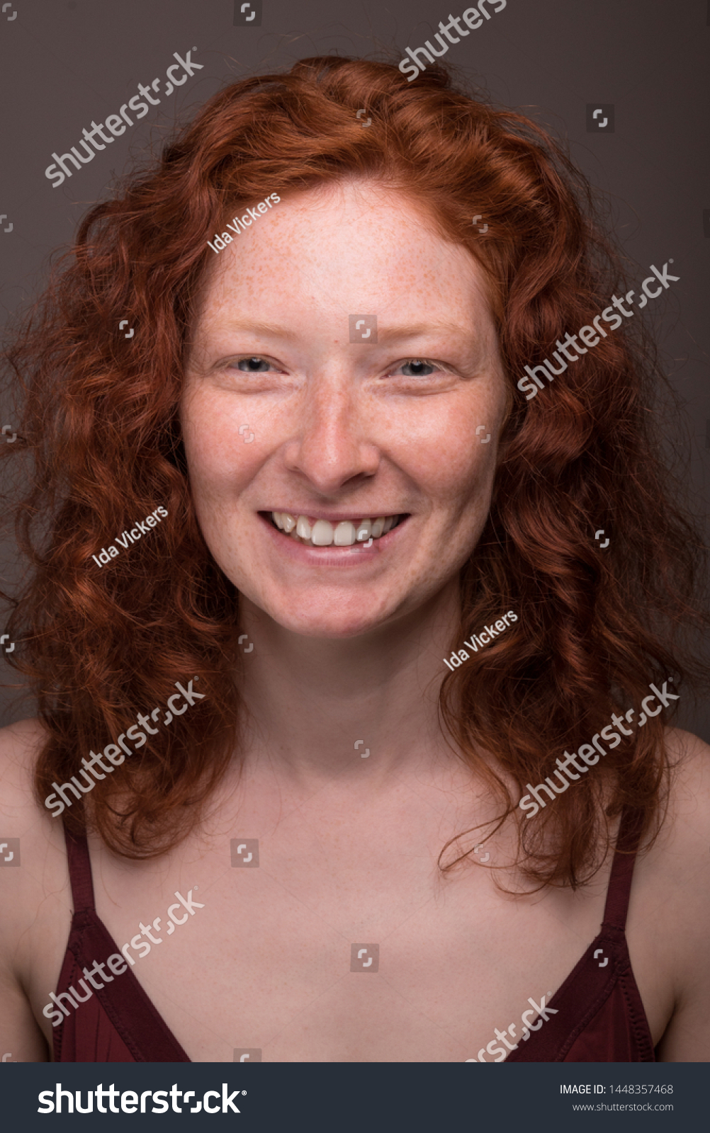 stock-photo-portrait-of-beautiful-caucasian-european-irish-woman-with-freckles-red-hair-redhead-ginger-gray-1448357468.jpg