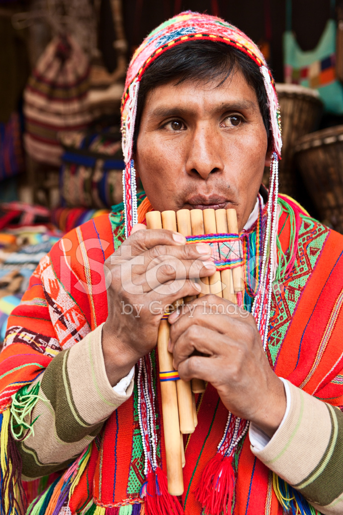 13507193-portrait-of-peruvian-man-playing-a-siku-panpipe-pisac-market.jpg