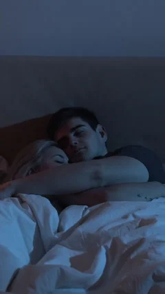 sleeping-couple-night-rest-hugging-footage-229622145_iconm.jpeg