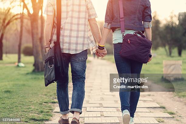 rear-view-of-teenage-couple-in-the-park.jpg