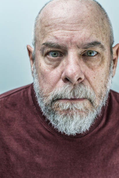 ominous-spooky-staring-senior-adult-man-picture-id667672380