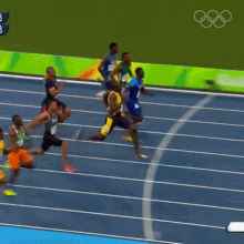 a group of athletes are running on a track and the omega logo is visible a group of athletes are running on a track and the omega logo is visible