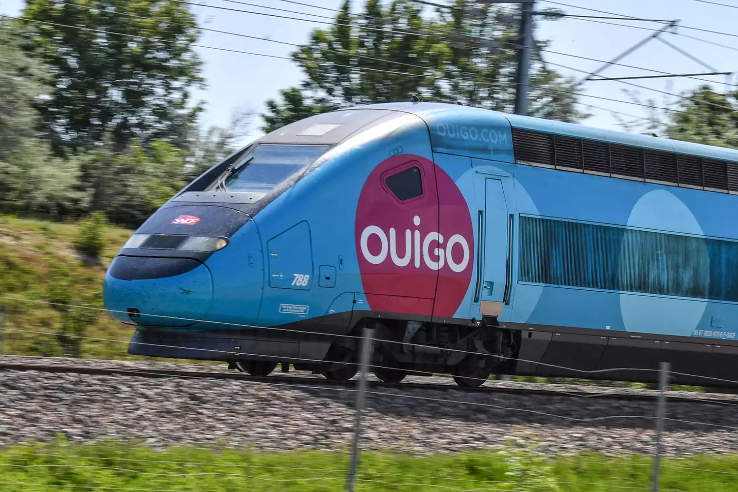A SNCF's low-cost Ouigo TGV train passes at high speed in the direction of Paris on June 2, 2021 A SNCF's low-cost Ouigo TGV train passes at high speed in the direction of Paris on June 2, 2021