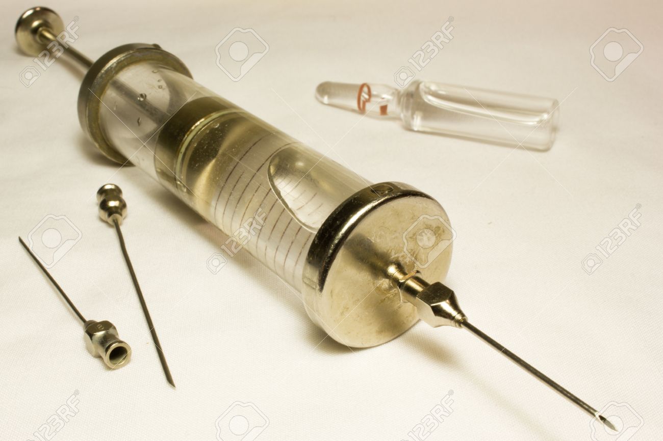 55668614-iron-vintage-glass-syringe-with-needles-on-a-white-background-.jpg