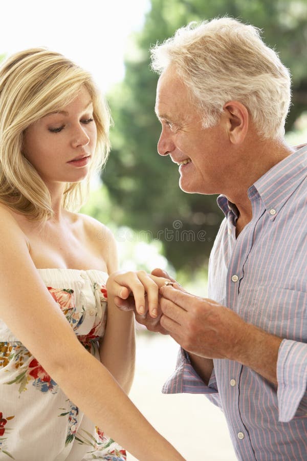 older-man-proposing-to-younger-woman-55890525.jpg