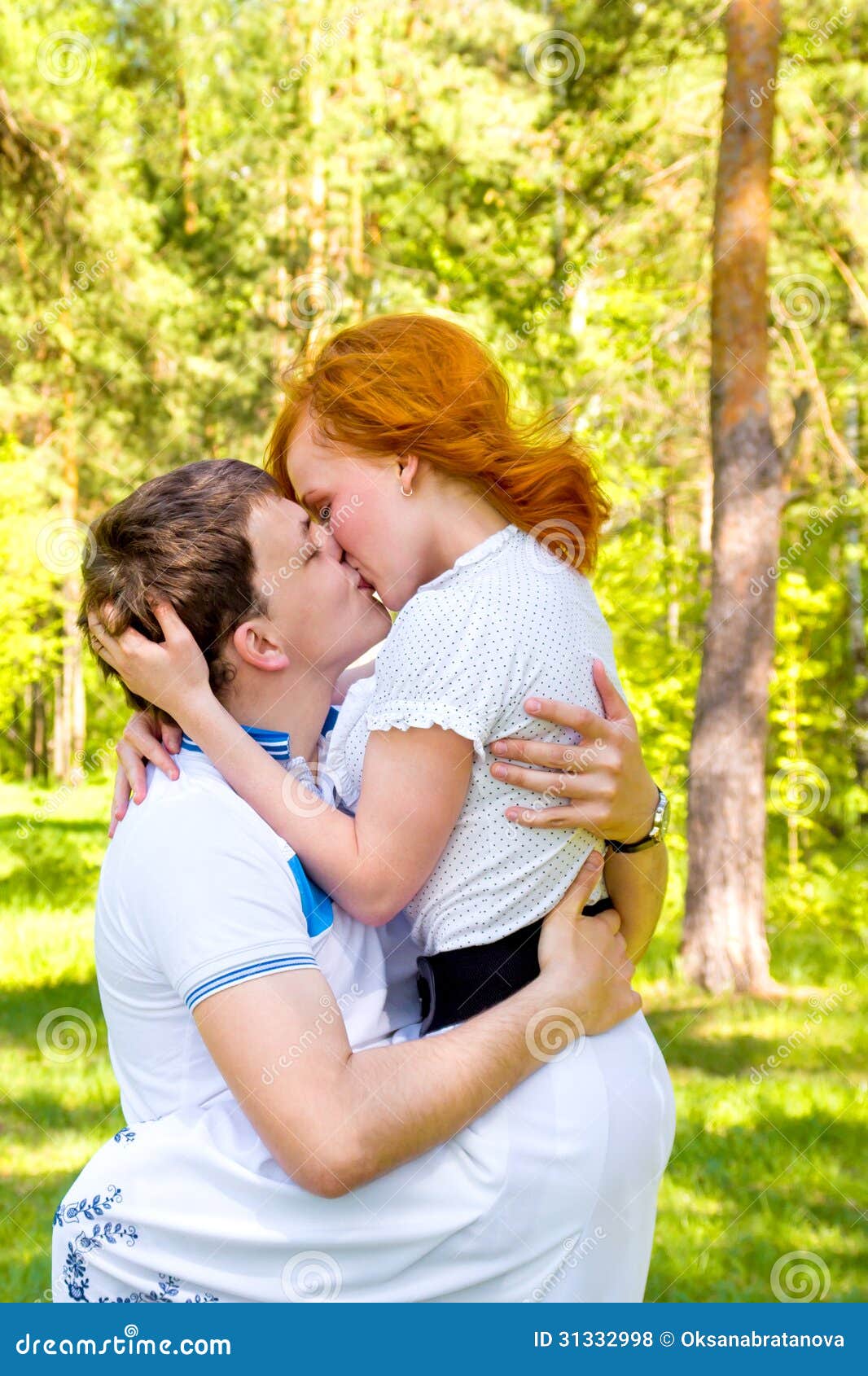 happy-couple-kiss-outdoor-love-posing-kissing-spring-summer-park-sunny-weather-young-boy-girl-having-fun-31332998.jpg