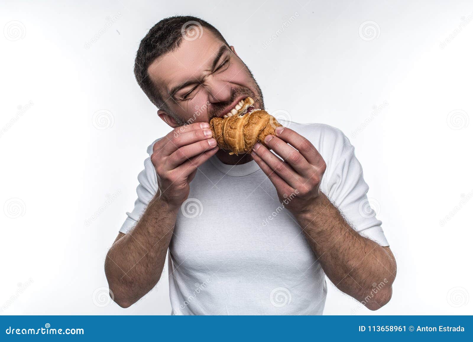 man-eating-croissan-biting-hard-likes-french-dessert-isolated-white-background-man-eating-croissan-113658961.jpg