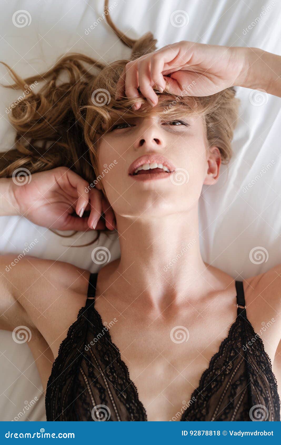 view-above-woman-lying-bed-sexy-looking-camera-vertical-photo-92878818.jpg